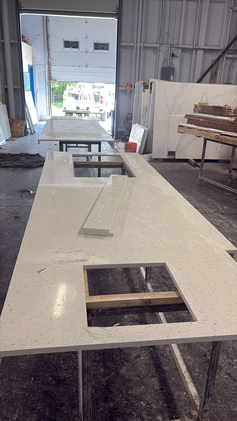 Fabricated counter run with sink and cooktop cutouts, ready to set