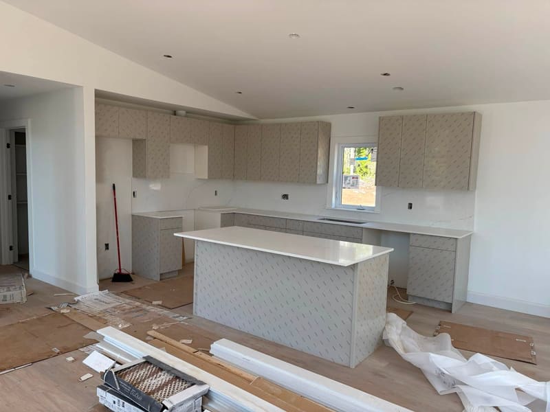 Perimeter quartz counters set and seamed during an install