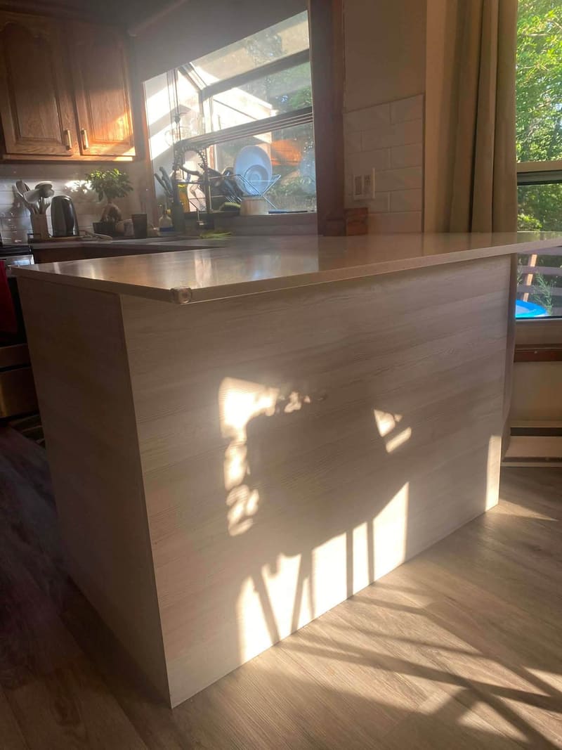 Waterfall peninsula counter lit by late afternoon sun
